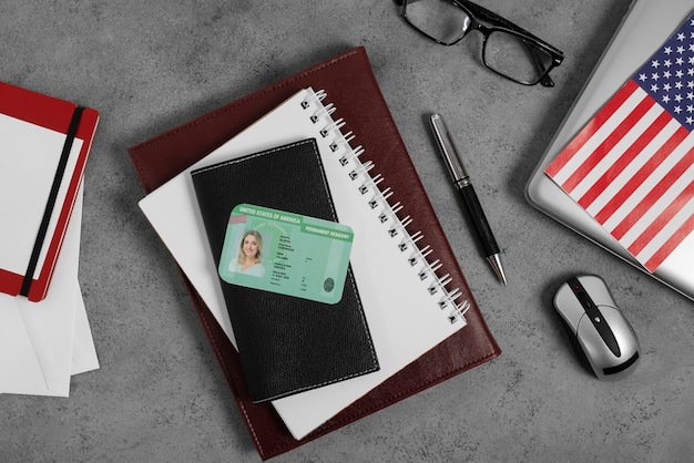A close-up shot of a U.S. Social Security card on top of a desk filled with financial planning documents, emphasizing the importance of understanding the Social Security system for retirement financial security.