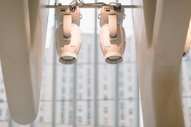 A close-up of a smart curtain motor and track system installed above a window. The focus is on the mechanical components and how they integrate with the curtain fabric.