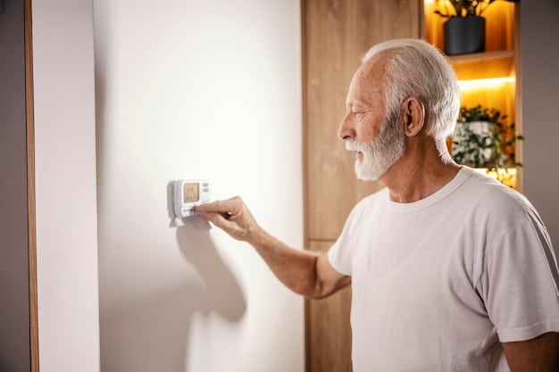 A technician installing a smart thermostat in a senior's home, explaining the features and benefits to the senior.
