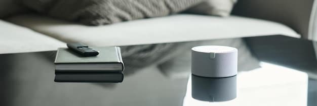 A close-up of a smart speaker on a nightstand, next to a glass of water and a pill organizer. The speaker is displaying a large, easy-to-read clock.
