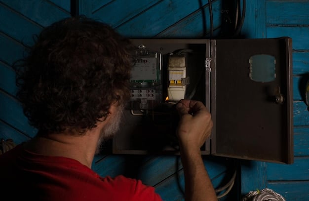 An electrician inspecting a home electrical panel with a flashlight, checking for loose connections and outdated wiring. Safety equipment like gloves and eye protection are visible. The panel is open, displaying a complex network of wires and circuits.