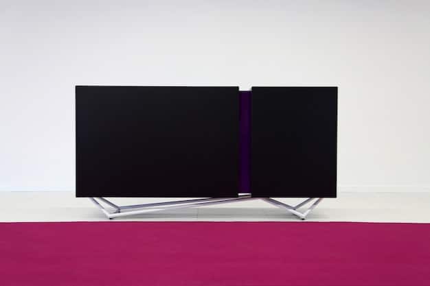 A side-by-side comparison of two TV screens. The left screen displays a 4K image, while the right screen shows the same image in 8K. Subtle differences in clarity and detail are visible upon closer inspection.